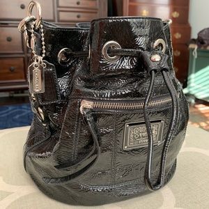 Coach Black patten leather drawstring Poppy bag